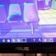 A photo of a centered Windows 10 taskbar on a monitor